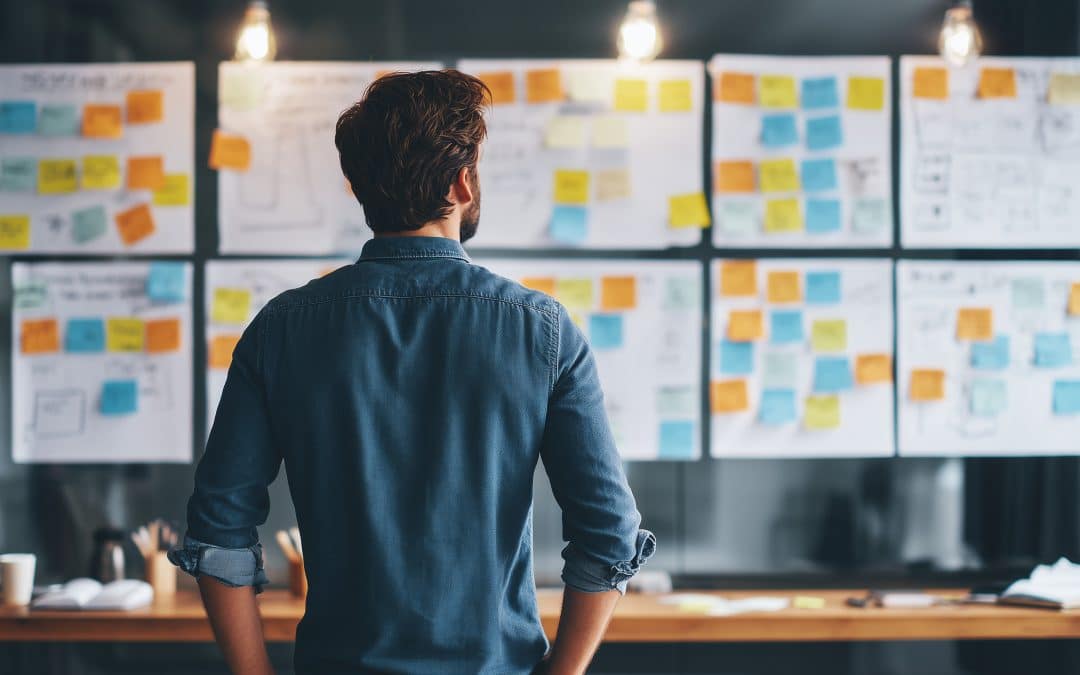 business owner reviewing website messaging strategy on whiteboard